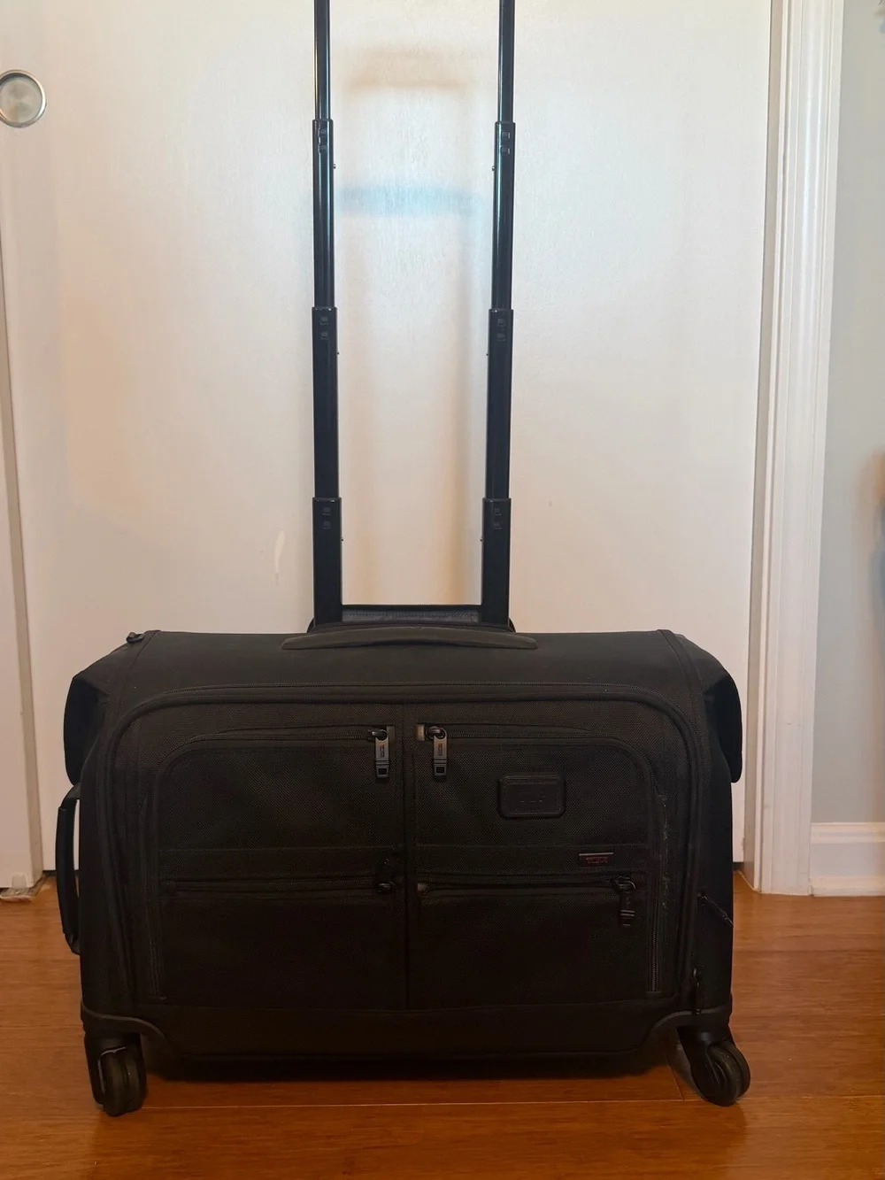 Tumi Black Garment Spinnerwith Front Organization Pockets